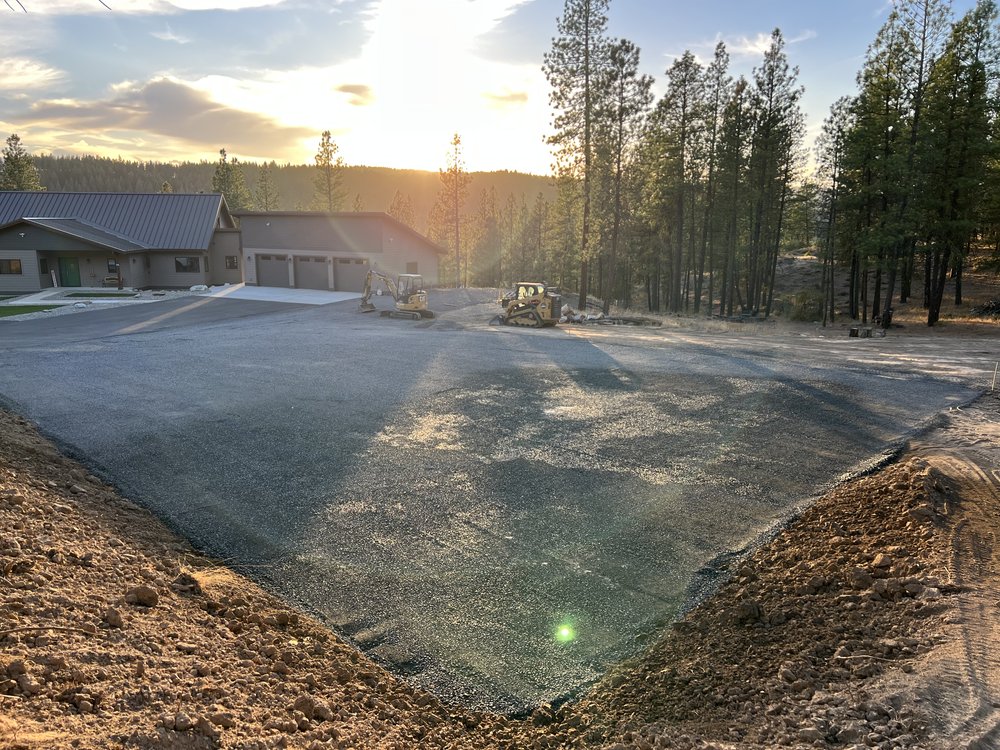 A newly constructed gravel parking lot by Jewett Dirt Works, providing durable and well-graded parking solutions for residential and commercial properties in Kittitas County, Tri-Cities, Yakima, and Ellensburg.