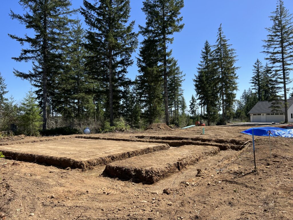 Excavation in progress for a new home foundation by Jewett Dirt Works, ensuring precise digging and grading for a stable build site in Kittitas County, Tri-Cities, Yakima, and Ellensburg.